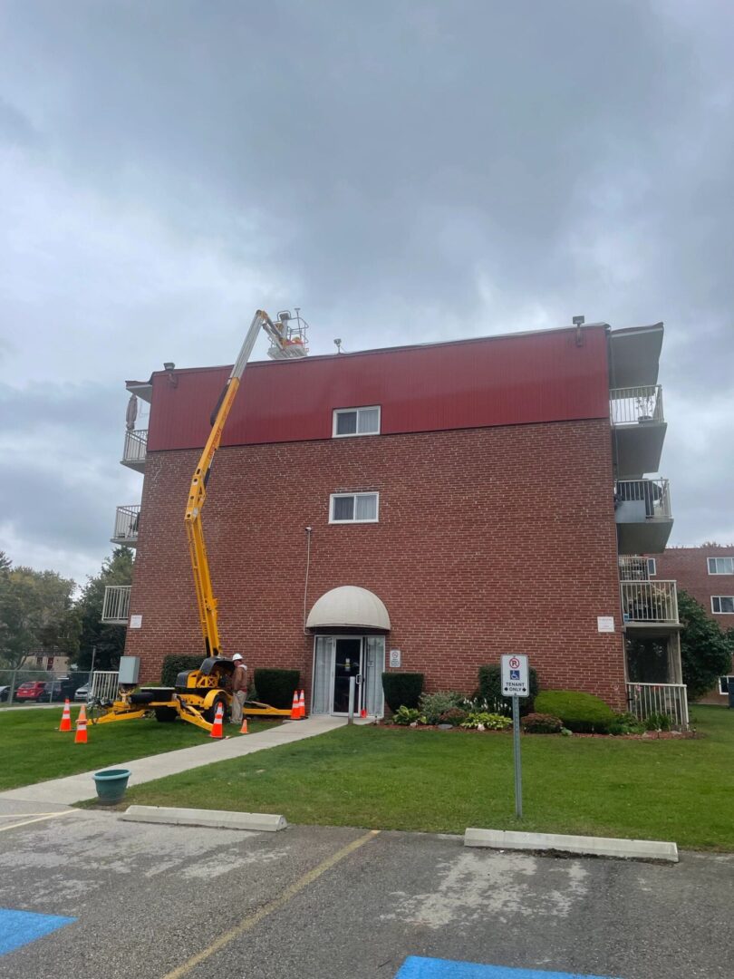 A crane is in front of the building.